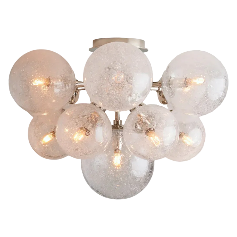 Chandelier with multiple glass globe lights on a light gray background